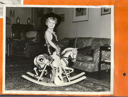 Rex Bell Jr. riding on a hobby horse at Walking Box Ranch, Nevada: photographic print