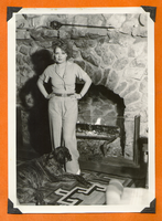 Clara Bow Bell standing in front of the fireplace at Walking Box Ranch, Nevada: photographic print