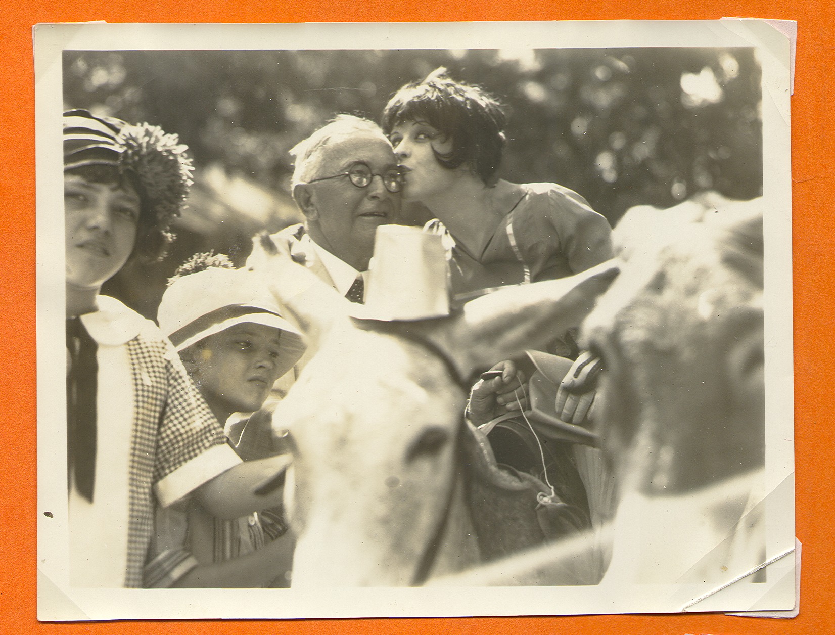 Clara Bow Bell and a group of unidentified people on a movie set: photographic print
