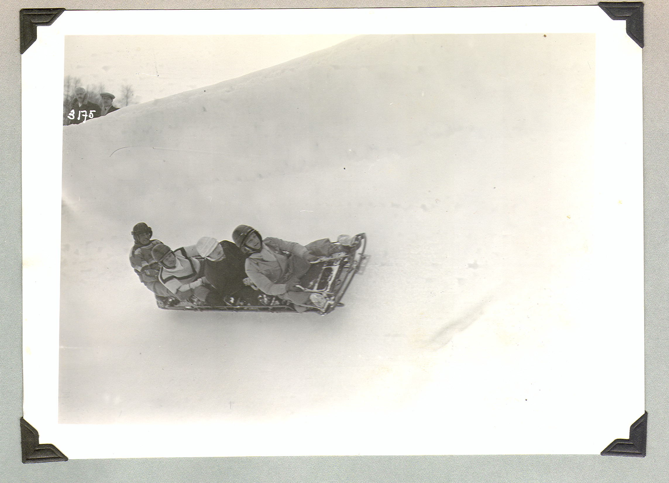 Rex Bell and an unidentified group bobsledding in Europe: photographic print