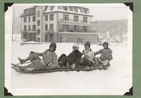 Rex Bell and an unidentified group on a bobsled during the Bell's honeymoon in Europe: photographic print