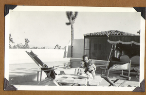 Clara with Toni Larbow Beldam on the left and George Francis Robert Bell on the right sitting by the pool at the ranch: photographic print