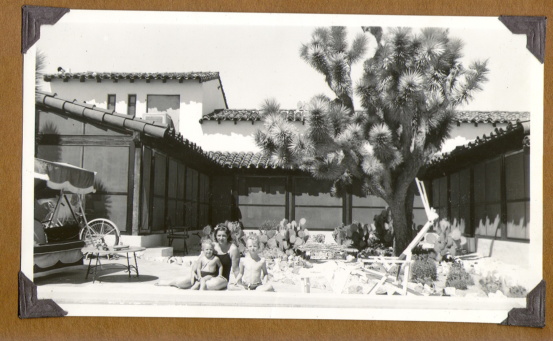 Clara and the Rex Anthony Bell, Jr (Toni Larbow Beldam) is seated on the right and George Francis Robert Bell is on the left on the patio at the ranch: photographic print