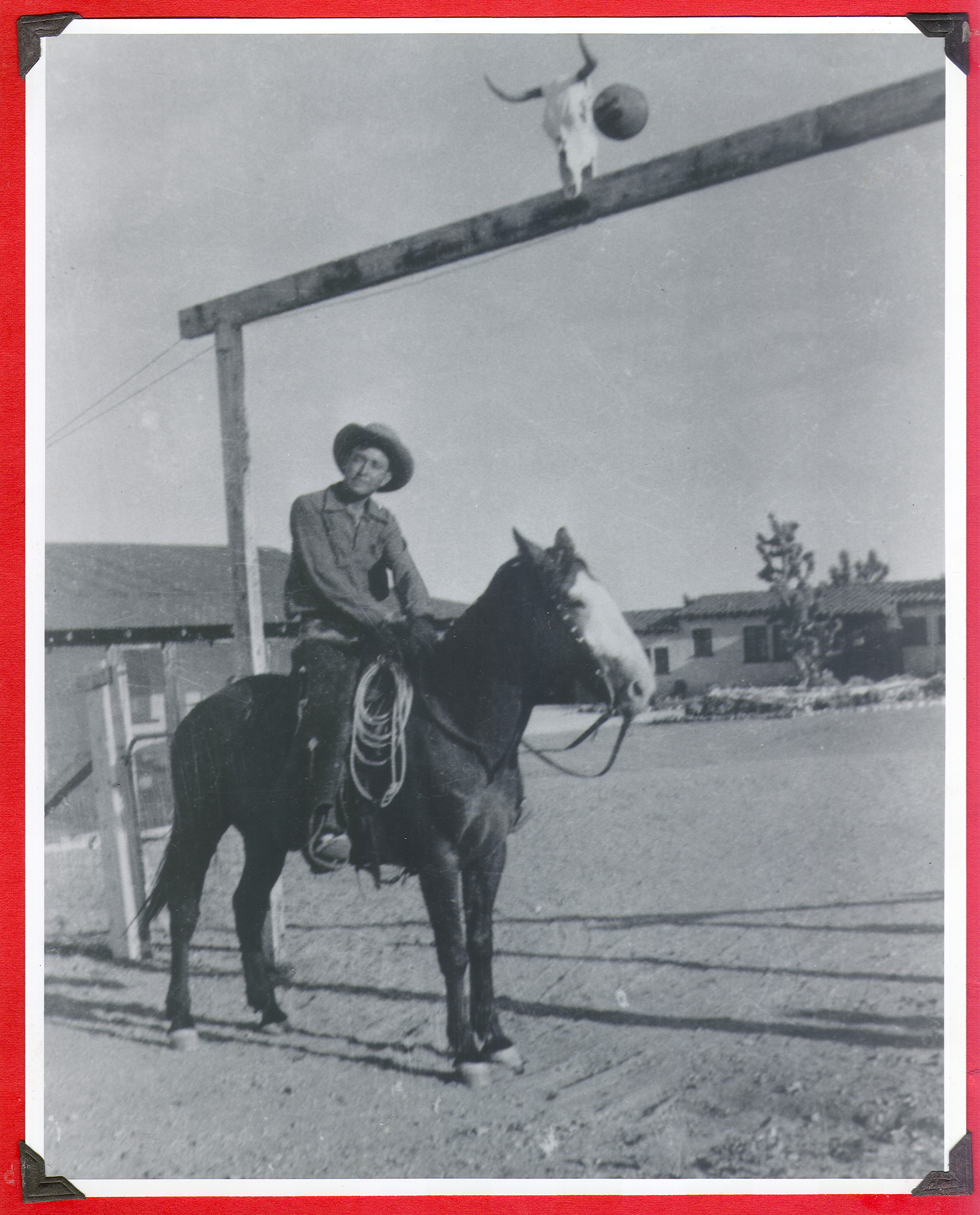 Red Vergani (Sp?) (cowboy) on horseback at the entrance to the ranch: photographic print