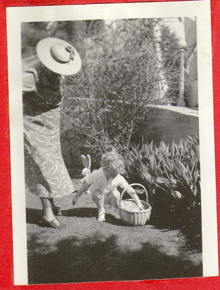 Woman (grandma?) with Rex Jr. hunting Easter eggs in (Calif.), photographic print