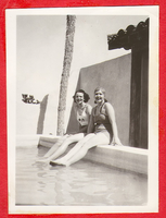 Two women on the side of the pool at Walking Box, Nevada - Clara at right: photographic print