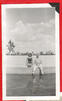 Two people sitting on the side of the pool at Walking Box, Ranch: photographic print