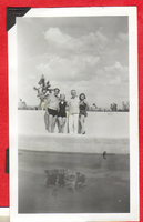 Four people posing by the swimming pool at Walking Box Ranch, Nevada: photographic print