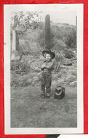 Rex Bell Jr. posing in a cowboy hat: photographic print