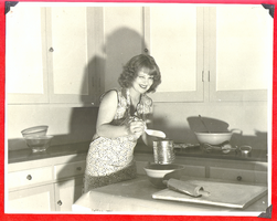 Clara Bow Bell baking in the ranch kitchen: photographic print