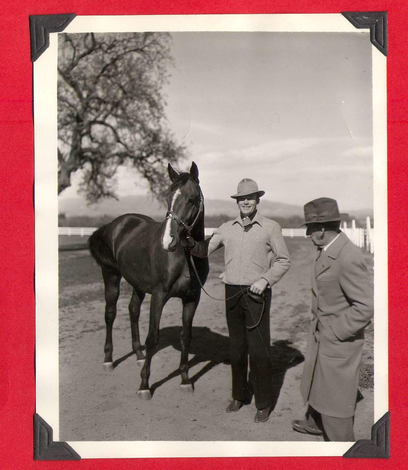 Two unidentified men and Rex Bell's race horse: photographic print