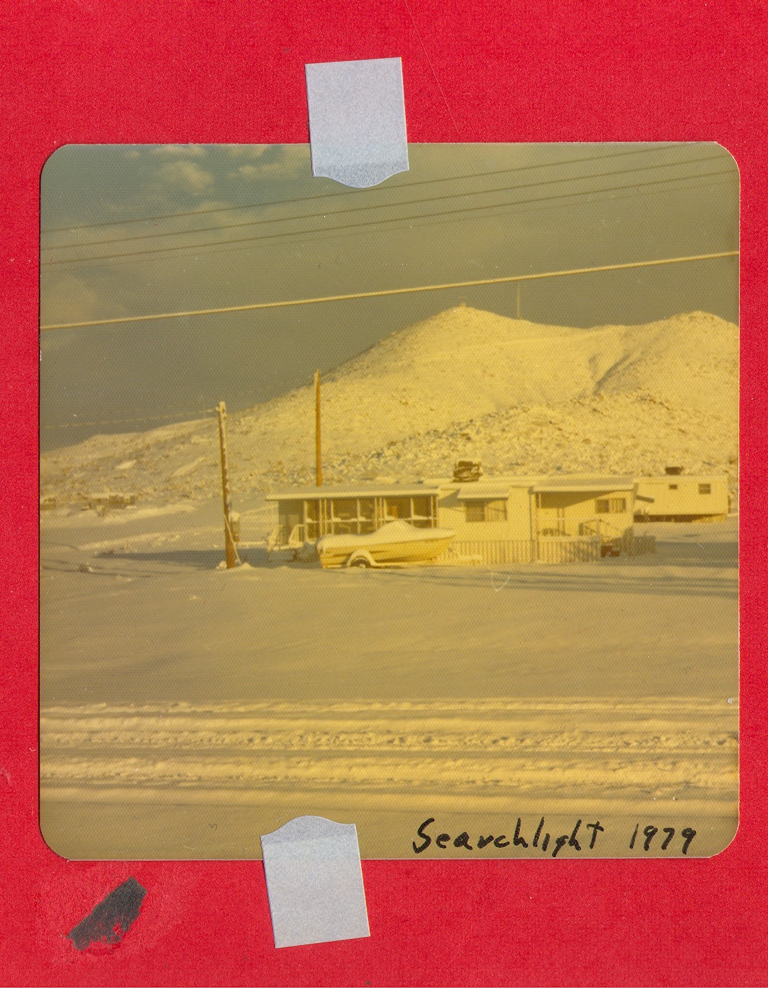 Trailers and boat at Searchlight, (Nev.), after snowfall, 1979: photographic print