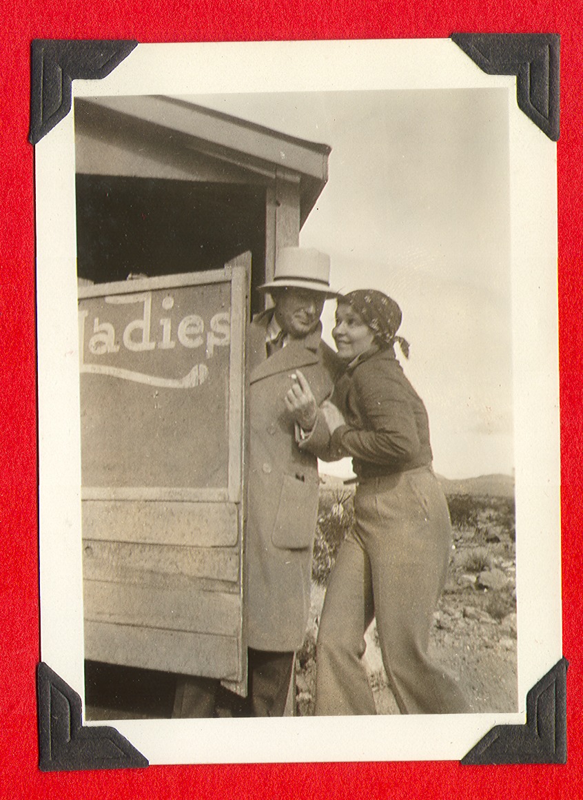 Unknown man (left) and Clara Bow (right) outside a ladies room at unknown location: photographic print