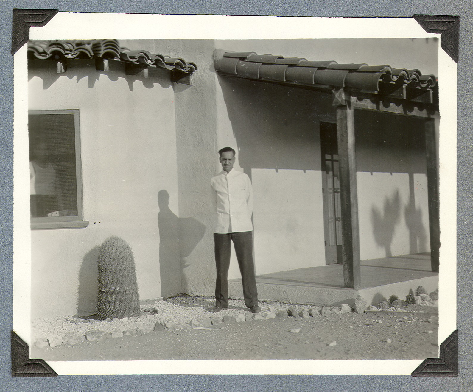 Richard, the Bells' cook, outside the ranch house: photographic print