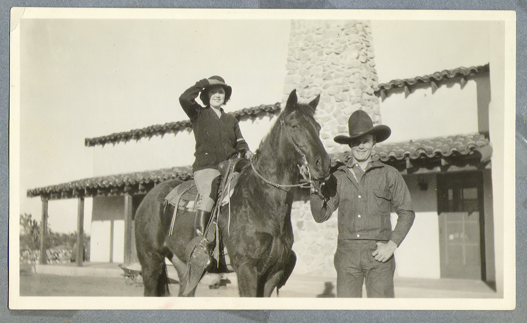 Marion Lewyn on horseback next to Rex Bell: photographic print