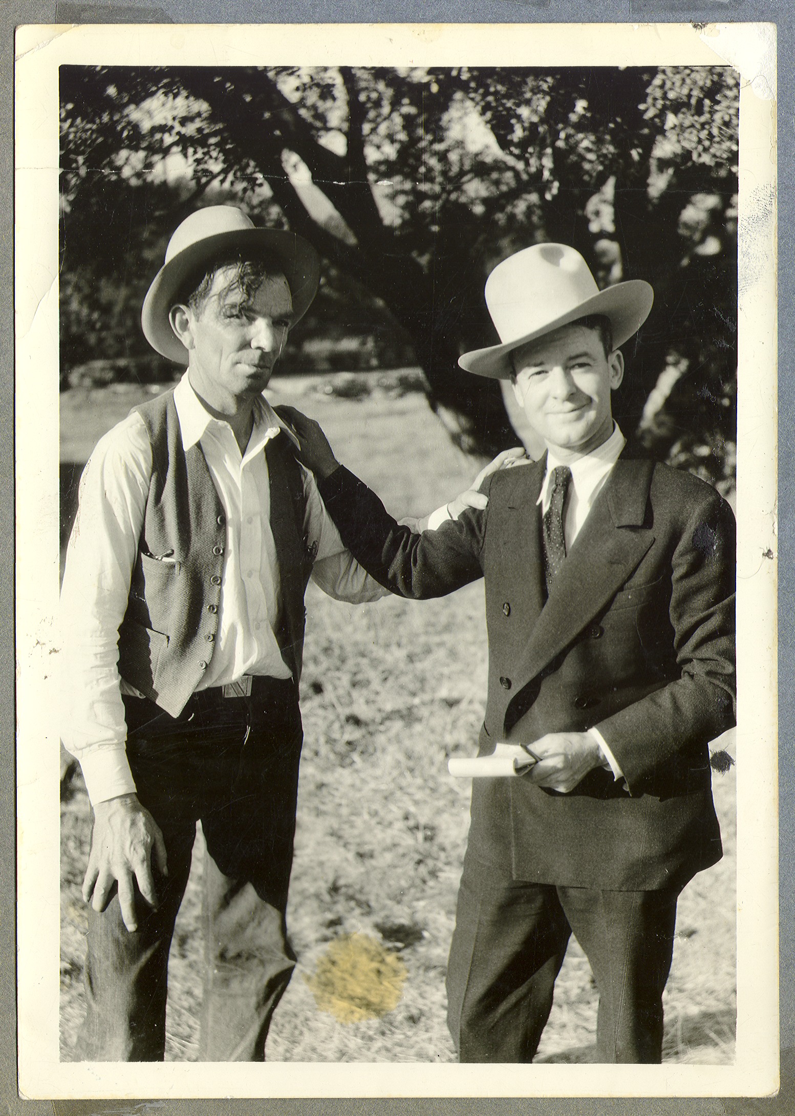 Curley Fletcher on left with unidentified man: photographic print