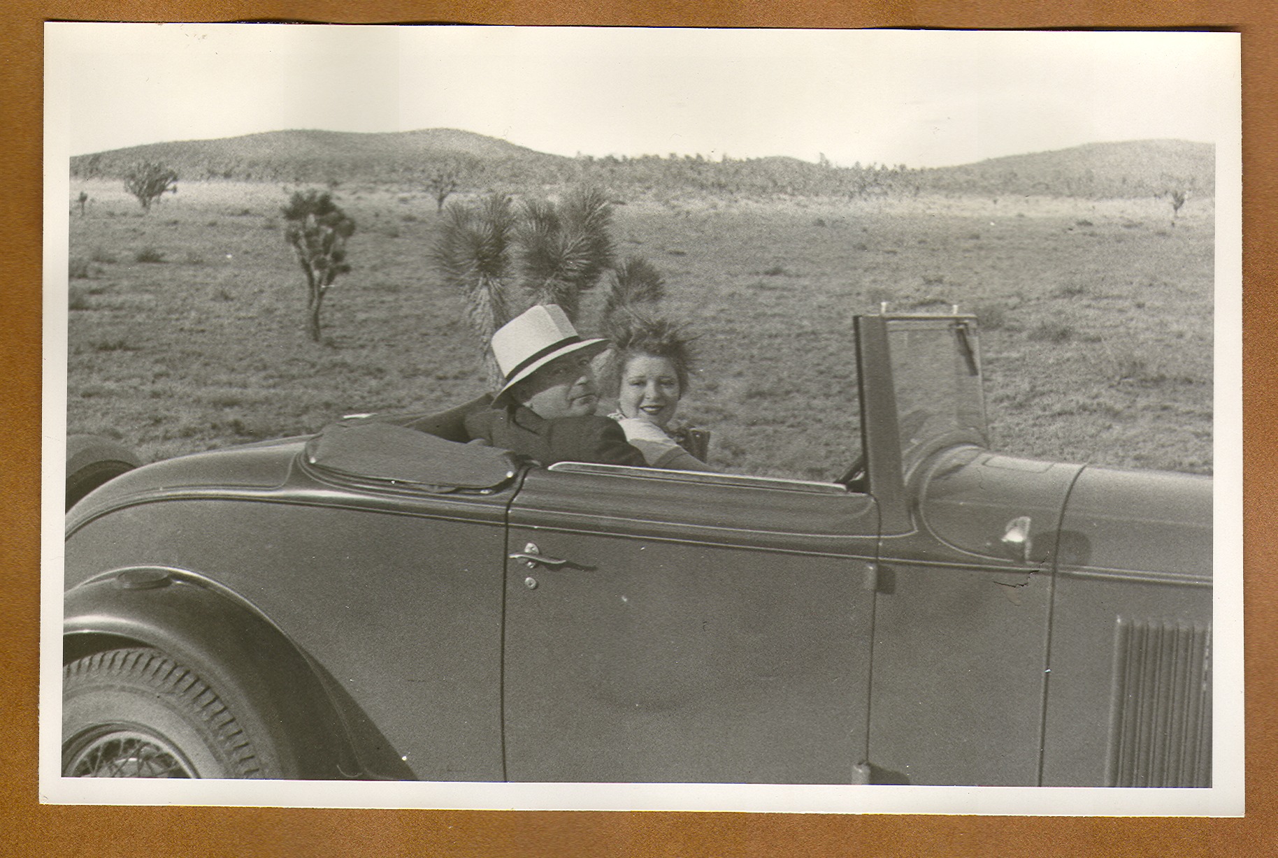 Clara Bow Bell in a convertible with an unidentified man: photographic print