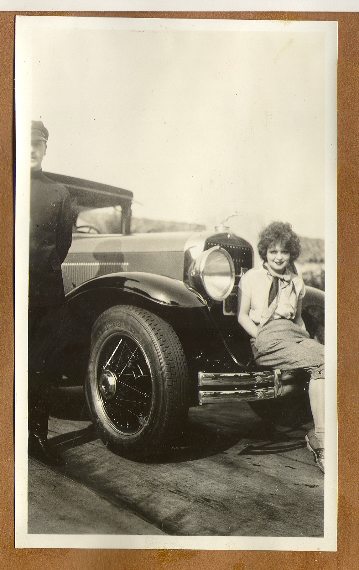 Clara Bell Bow seated on the front bumper of her Rolls Royce: photographic print
