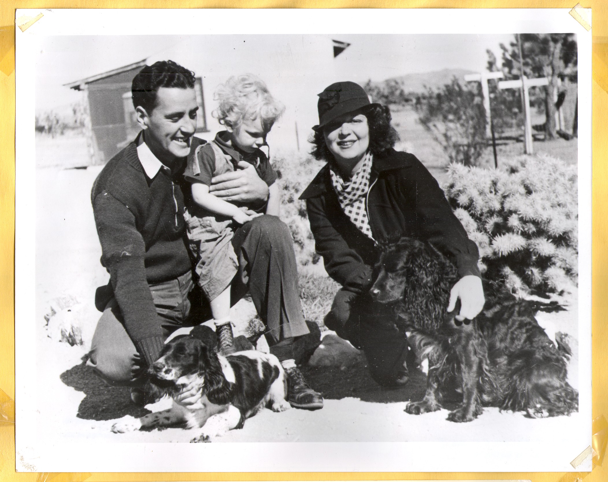Clara Bow Bell (right) and two dogs; her cousin Billy Bow holding Rex Jr.: photographic print