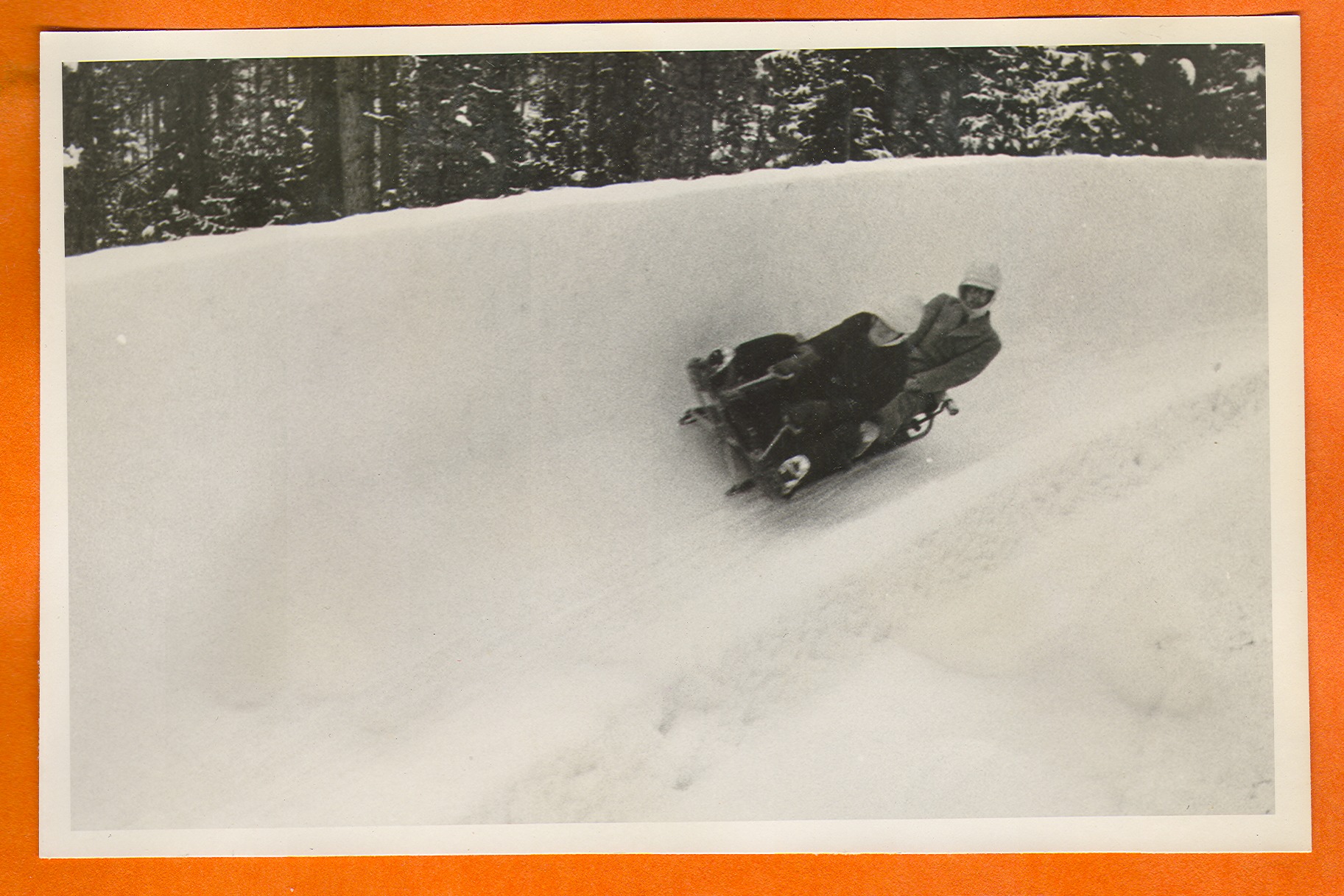 Two people on a bobsled in Europe: photographic print