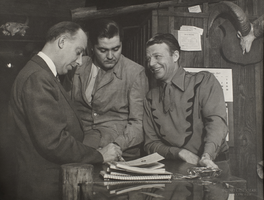 Rex Bell (George Francis Beldam) with two unidentified people inside the "Rex Bell's Frontier & Sportswear" store in Las Vegas, Nevada: photographic print