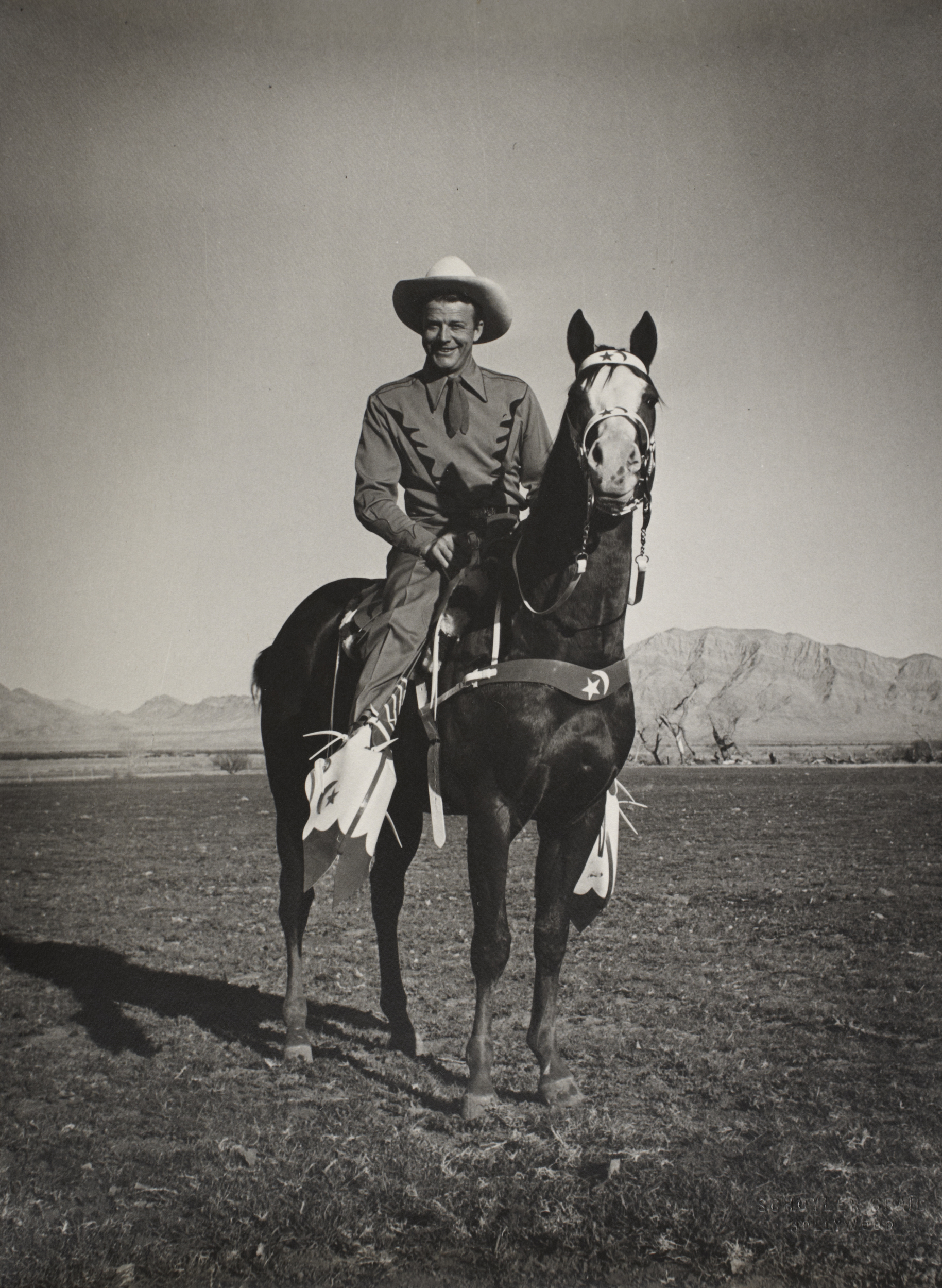 Rex Bell on horseback: photographic print