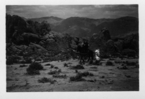 Person on horseback in mountainous area: photographic print 