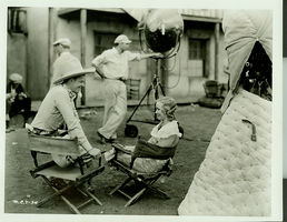 Scene from a movie set Rex Bell (George Francis Beldam). Copyright notice on back of image: Monogram Pictures, 6049 Sunset Blvd. Hollywood, California