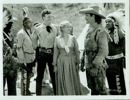Studio photograph from Universal Studio Pictures Corp. film Battling with Buffalo Bill.  Rex Bell (George Francis Beldam) in costume. Labeled on back of image:"Univeral's serial thriller, 'Battling with Buffalo Bill' with Tom Tyler, Lucile Browne, Rex Bell, William Desmond, Jim Thorpe, Francis Ford and George Regas."