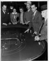 Groupd of people at a gambling table