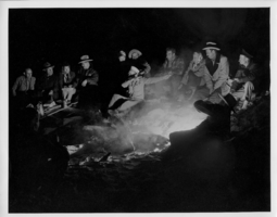Unidentified group around a campfire