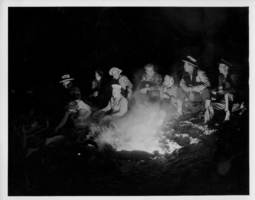 Unidentified group around a campfire