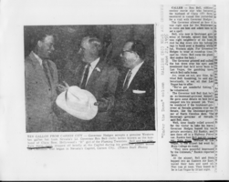 Newspaper article about Lt. Gov. Rex Bell (George Francis Beldam) giving a hat to Govenor Hodges.  Noted article is from the Raleigh, NC News and Observer, June 22, 1955