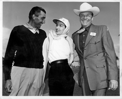 Rex Bell (George Francis Beldam) (right) with two other unidentified people at an unknown location. Stamped back: Mark Swain - Photographer, Wilbur Clark's Desert Inn, Las Vegas, Nevada
