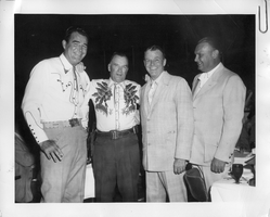 Right to left: Major Len Harris of Reno, Sen. Geo. W. Malone of Nevada, Rex Bell (George Francis Beldam) and Rod Cameron a State Trooper at the Riverside Hotel in Reno on July 3, 1957. Handwritten on back: Right to left: Major Len Harris of Reno, Sen. Geo. W. Malone of Nevada, Rod Cameron - State Trooper. Dinner in Reno, July 3, 1957. Riverside Hotel. Handwritten attached note: Thought you might be interested in the enclosed picture. Thank you for attending. John L. Long