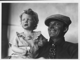 Photo of Rex Bell (George Francis Beldam) with Rex Anthony Bell, Jr (Toni Larbow Beldam) as a child