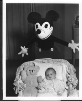 Photo of Rex Anthony Bell, Jr (Toni Larbow Beldam) as an infant with large Mickey Mouse toy