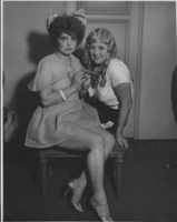 Clara Bow in costume for a 1933 Hollywood party with an unidentified woman in an unknown location