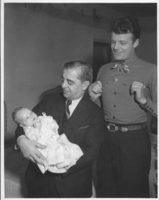 Professional photograph of Robert "King" Bow, Rex Bell (George Francis Beldam)(standing) and Rex Anthony Bell, Jr (Toni Larbow Beldam) as an infant