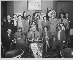 The Thunderbird Hotel, Las Vegas in 1948.  Rex Bell (George Frances Beldam), Mrs. Canzoneri,  two other unidentified and Edgar G. Robinson (Movie Star) in foreground.  Mr. Hicks, Joey Adams (Comic), Clara Bow, and Tony Canzoneri - ex champion fighter of the world and others. Handwritten on back:  Thunderbird Hotel, Las Vegas in 1948.  Dad, Mrs. Canzoneri, two others I do not know and Edgar G. Robinson (movie star) in foreground.  Mr. Hicks, Joey Adams (Comic), Mom, and Tony Canzoneri - ex-champion fighter o