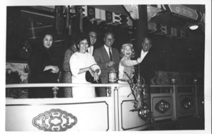 Rex Bell and a group of unidentified people on board the Tai Pak Floating Restaurant in Aberdeen, Hong Kong: photographic print