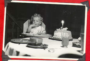Rex Bell Jr. with his first birthday cake: photograph