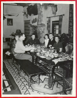 Group seated at the dining room table at Walking Box Ranch with Rex Bell at end of table: photograph