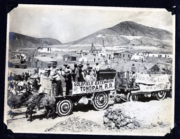 Photograph of advertisements on ore wagons at Tonopah Railroad Carnival, Tonopah (Nev.), early 1900s