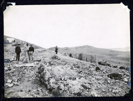 Photograph of men loading ore at Sandstorm Mine, Esmeralda (Nev.), early 1900s