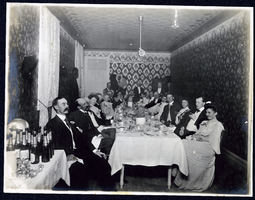 Photograph of people seated around table at dinner party, Tonopah (Nev.), early 1900s