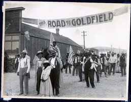 Photograph of a crowd celebrating in street, Tonopah (Nev.), early 1900s