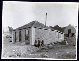 Photograph of children posing outside of house built of beer bottles, Tonopah (Nev.), 1902