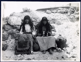 Photograph of Western Shoshone girls with puppies, Goldfield (Nev.), early 1900s