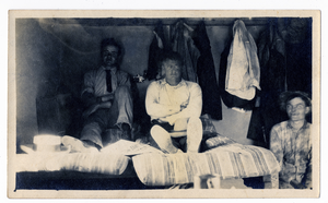 Photograph of three men resting at lodging, Goldfield (Nev.), early 1900s